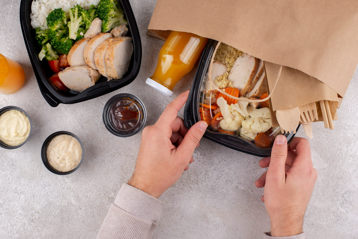 takeaway food in reusable plastic and paper packaging